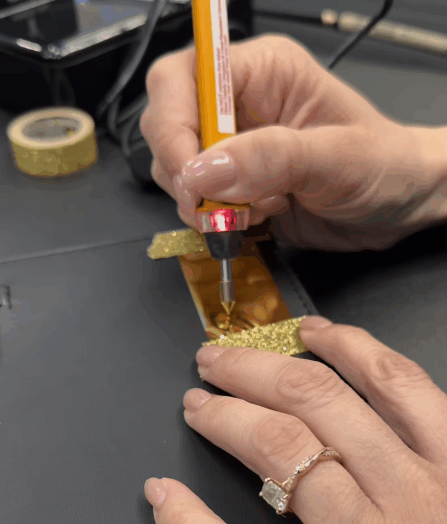 Process photo for hot foiling calligraphy at a live event conference