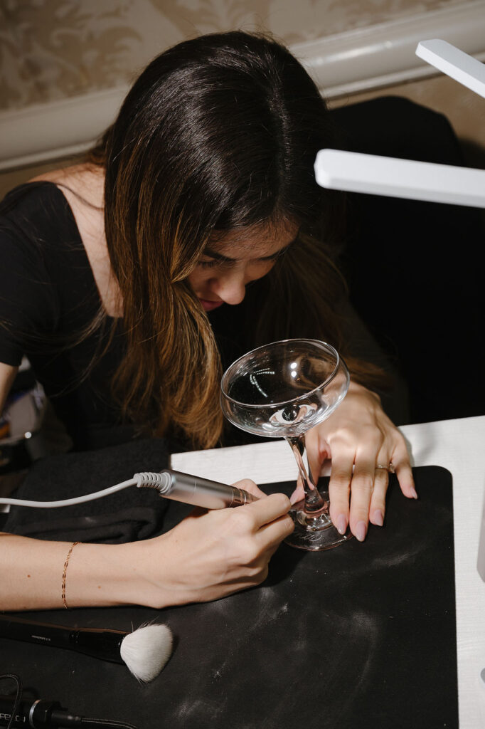 Los Angeles Hand Engraver Dani personalizing coup glasses