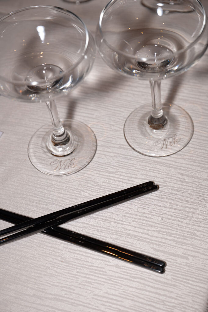 Two coup glasses and chop sticks hand engraved