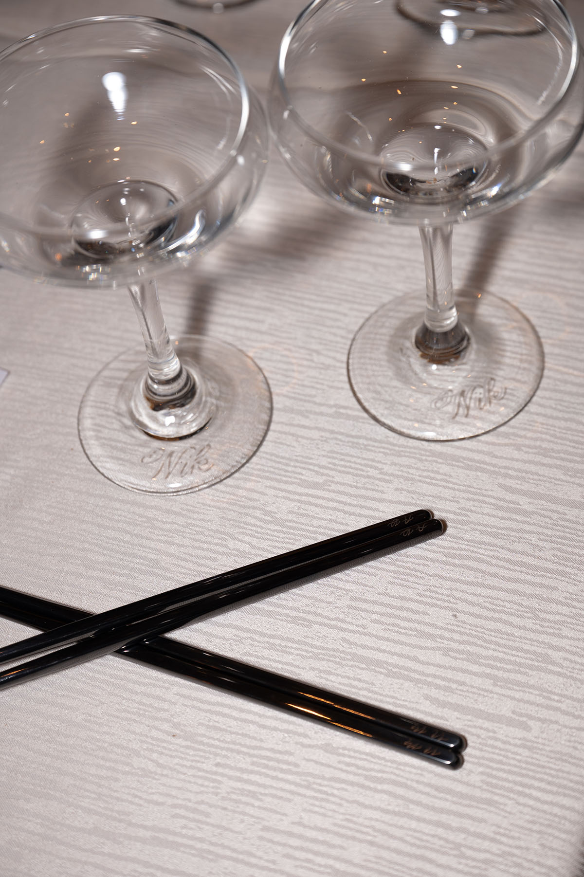 Two coup glasses and chop sticks hand engraved
