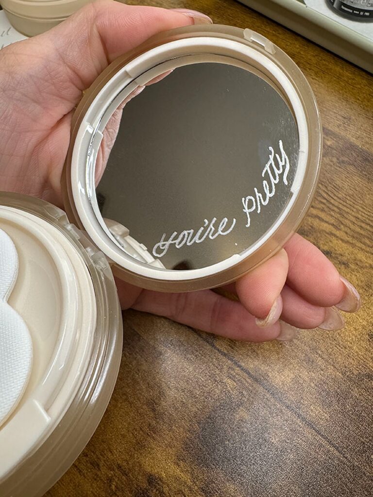 Example of calligraphy hand engraving on Yepoda Dewy Day Foundation Mirror