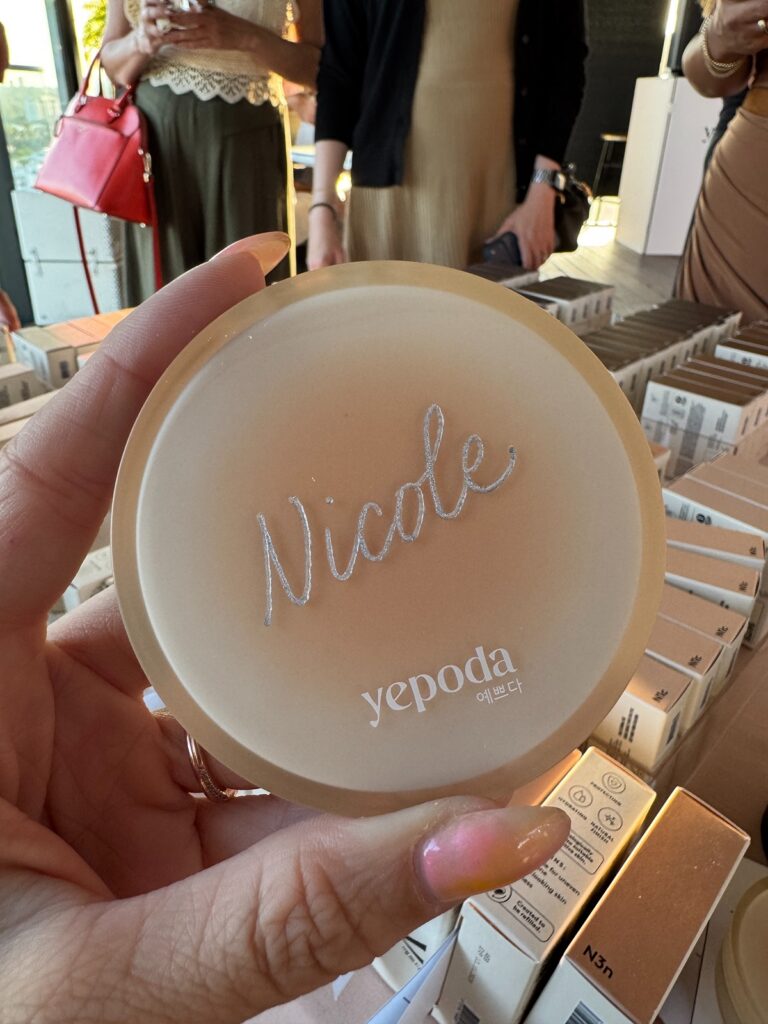 "Nicole" hand engraved on the top of a Yepoda Dewy Day Foundation