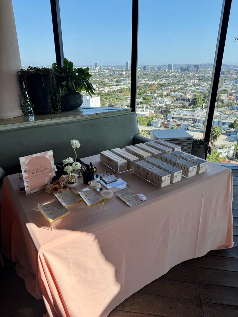 Yepoda Influencer Marketing Event engraving station setup next to a window with makeup neatly displayed